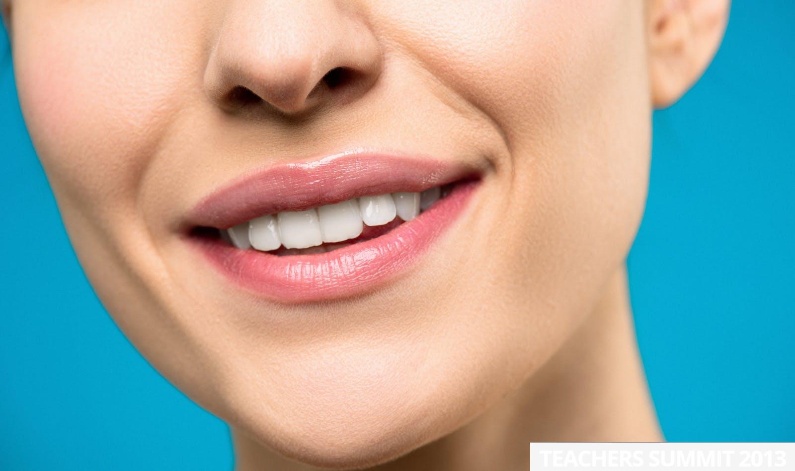 Close-up Photo of Woman With Pink Lipstick Smiling