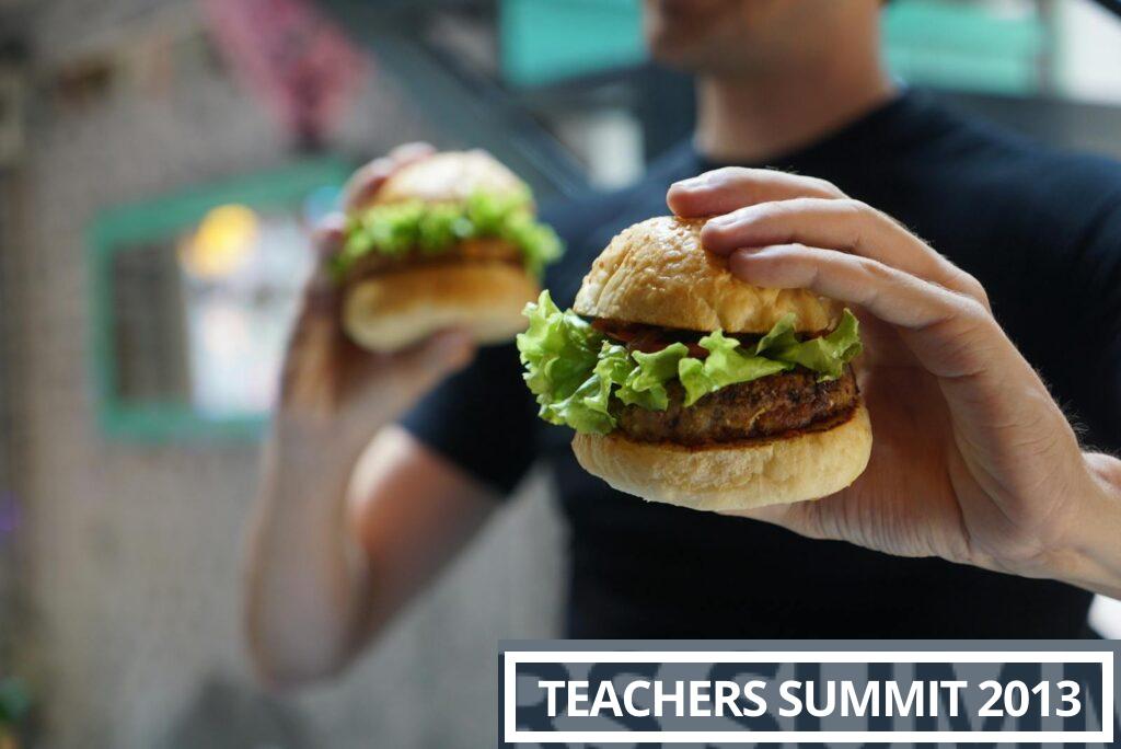 A close-up shot of a person holding a homemade burger with fresh lettuce, ideal for fast food themes.